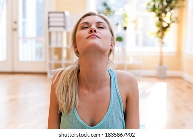 Fit Healthy Young Woman Streching In Her Home