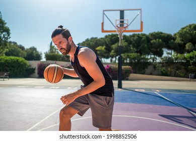 Fit Male Playing Basketball Outdoor, Sunny Weather, Modern Playground. Wide Lense Shot