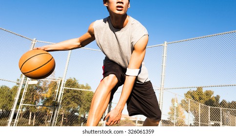 Fit Male Playing Basketball Outdoor