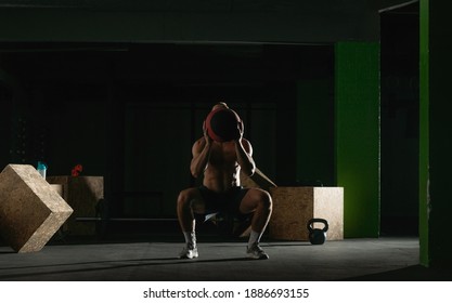 Fit Man Throwing Medicine Ball Doing Ball Slam Against Gym Floor Or Shoulder Press Exercise.