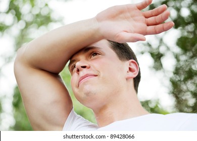 Fit Man Wiping Sweaty Forehead