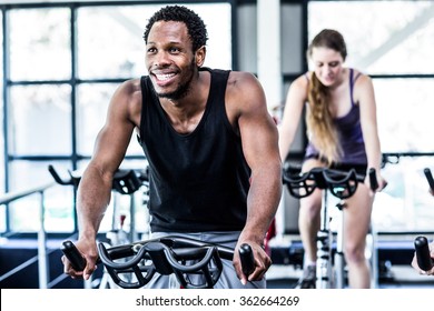 Fit man working out at class in the gym