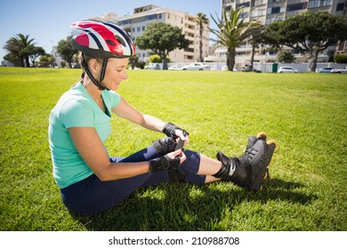 Fit Mature Woman In Roller Blades On The Grass On A Sunny Day