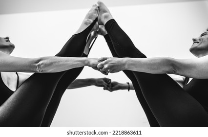 Fit Mature Women Couple Doing Acro Yoga. Yoga, Balance And Mindful Relaxation  Concept.