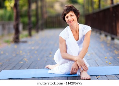 Fit Middle Aged Woman Relaxing After Workout