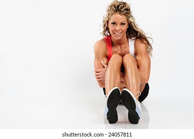 Fit Model In Workout Gear On White Studio Backdrop.