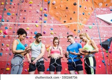 Fit people getting ready to rock climb at the gym - Powered by Shutterstock