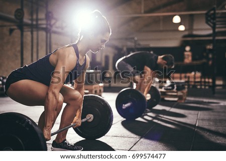 Similar – Foto Bild Frau beim Training im Fitnessstudio mit Gewichten