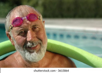 Fit Senior Man Working Out In The Swimming Pool