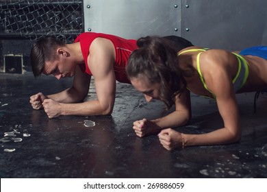 fit sportive man and woman doing plank core exercise training back and press muscles concept gym sport sportsman fitness workout strength power. - Powered by Shutterstock