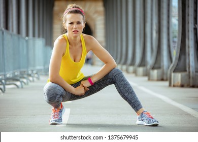 Fit Sports Woman In Fitness Clothes On Pont De Bir-Hakeim Bridge In Paris Relaxing After Workout.