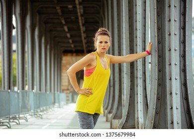 Fit Sports Woman In Fitness Clothes On Pont De Bir-Hakeim Bridge In Paris Relaxing After Workout.