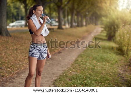 Similar – Attractive sporty woman with her cell phone