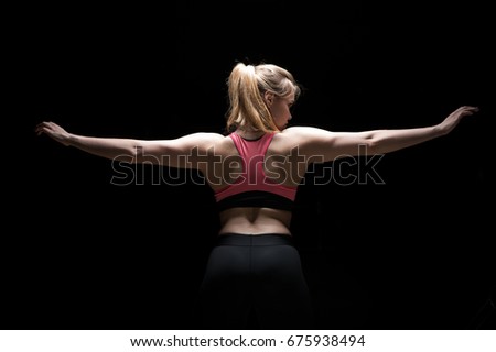 Similar – Image, Stock Photo Rear view portrait of one young middle age athletic woman at crossfit training, exercising with trx suspension fitness straps over dark background