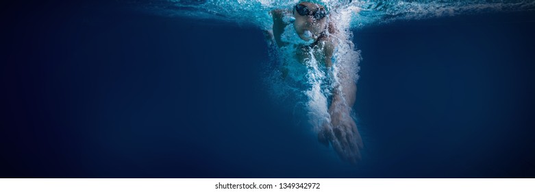 Fit Swimmer Training By Himself In The Swimming Pool At The Leisure Centre