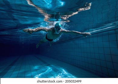 Fit Swimmer Training By Himself In The Swimming Pool At The Leisure Centre