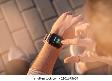 Fit Woman Checking Smart Watch Wearable Technology, Sport Smartwatch On Fitness Run Walk Outside. Top View From Above With Running Shoes In Street.