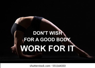 Fit woman doing yoga or pilates exercise. Fitness motivation quote with motivational text " Do not wish for a good body, work for it". Healthy lifestyle concept. Dwi Pada Viparita Dandasana pose