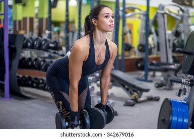 Fit Woman Fitness Performing Doing Deadlift Exercise With Dumbbell