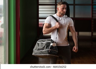 Fit Young Man With Gym Bag Going On The In Gym