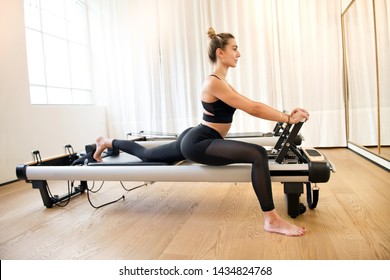 Fit Young Woman In Black Doing Lunge Stretch Yoga Pilates Exercise