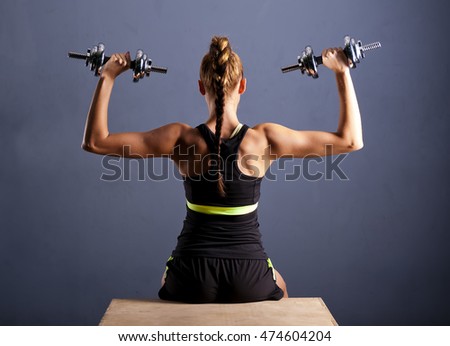 Similar – Rear view portrait of one young middle age athletic woman at crossfit training, exercising with trx suspension fitness straps over dark background