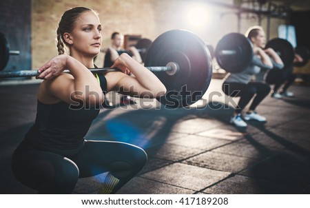 Similar – Foto Bild Frau beim Training im Fitnessstudio mit Gewichten