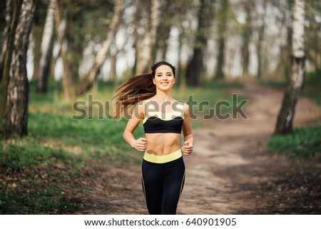 Similar – Fit healthy athletic woman jogging on a river bank