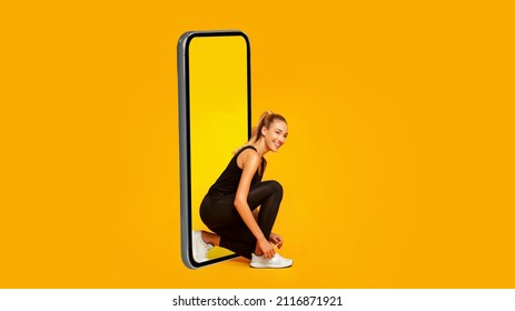 Fitness App. Sporty Female Lacing Shoes Near Big Cellphone Posing Over Yellow Studio Background, Preparing For Online Workout. Technology And Sport. Panorama, Collage - Powered by Shutterstock