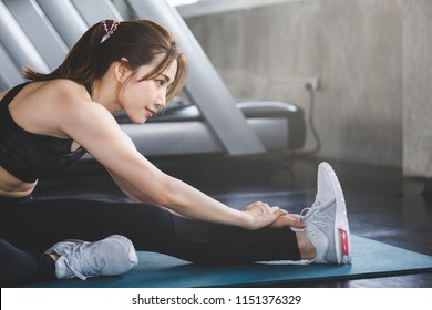 Fitness Asian Woman Doing Yoga Exercise And Relax With Sportswear In Sport Gym, Healthy Lifestyle Concept