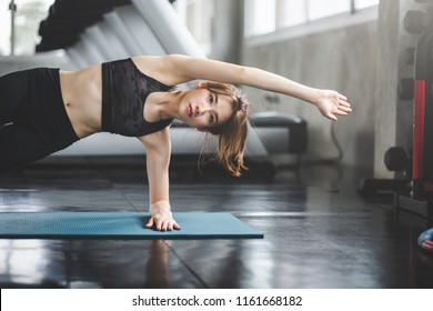 Fitness Asian Woman Doing Yoga Exercise And Relax With Sportswear In Sport Gym, Healthy Lifestyle Concept