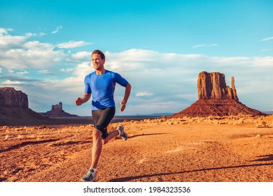 Fitness Athlete Runner Man Sprinting Ultra Running Across Desert Landscape Scenery On Run Trail Marathon Competition Outdoors. Endurance Long Distance Training. Monument Valley, USA.