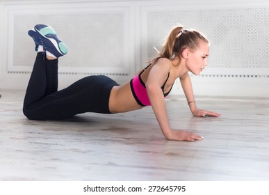 Fitness Athlete Sportive Woman Sport Model Girl Training Crossfit Doing Push Ups At Home.