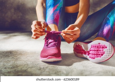 Fitness athletes foot close-up. Healthy lifestyle and sport concepts. Woman in fashionable sportswear is doing exercise. - Powered by Shutterstock