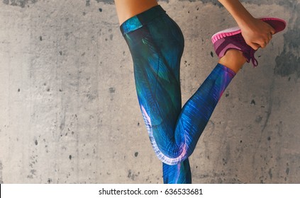 Fitness athletes foot close-up. Healthy lifestyle and sport concepts. Woman in fashionable sportswear is doing exercise.