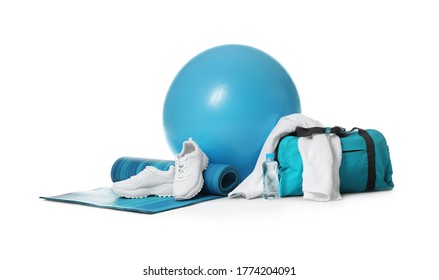 Fitness ball, gym bag and sport accessories isolated on white