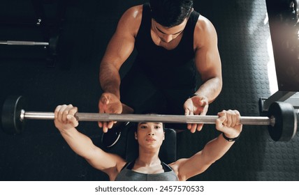 Fitness, bench press and woman with personal trainer for support, help and safety in gym workout. Weightlifting, exercise and girl in sports club with man for training challenge, teamwork and power. - Powered by Shutterstock