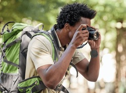 Fitness, Black Man And Hiking With Camera, Forest And Tourism In Nature, Capture Moment And Wilderness. African American Male, Hiker And Tourist Taking Pictures, Exercise And Walking In Mountains