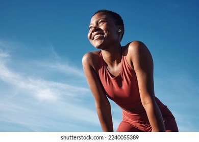 Fitness, black woman and happy athlete smile after running, exercise and marathon training workout. Blue sky, summer sports and run of a African runner breathing with happiness from sport outdoor - Shutterstock ID 2240055389