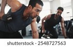 Fitness, bodybuilder and men in gym with weights for intense training, exercise and workout. Sports, personal trainer and people with dumbbell equipment for muscle strength, breathing and challenge