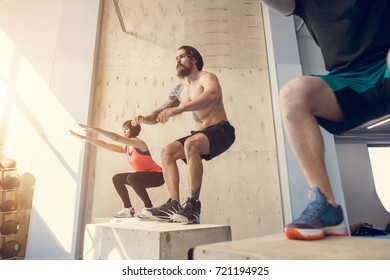 Fitness Box Jump People Group And Kettlebell Man At Gym