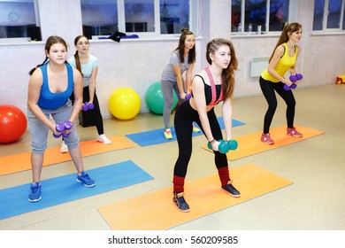 Fitness class dancing in studio at the gym.