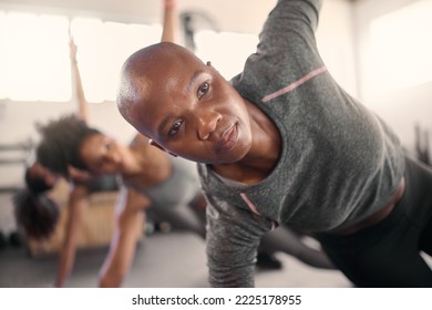 Fitness Class, Pilates And Black Woman Focus On Balance, Wellness And Yoga Pose In A Health Studio. Gym Training, Exercise And Workout For Peace And Healthy Sport Stretching With Women Group