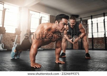 Fitness, coach and male athlete doing push up exercise for strength, health and wellness. Sports, training and man doing bodybuilding workout or challenge with personal trainer for motivation in gym.