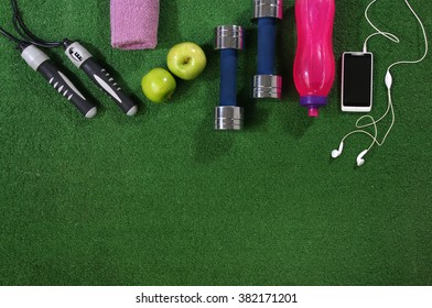 Fitness Concept. Various Elements Over A Grass Background