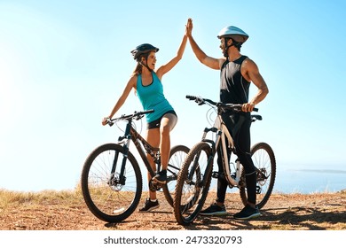 Fitness, couple and high five in mountain bike by nature for celebration, achievement and training goal. Happy people, man and woman with bicycle for exercise, workout and sports success in Germany - Powered by Shutterstock