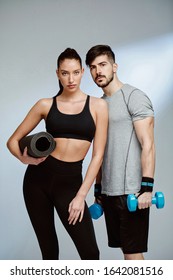 Fitness Couple Posing In Studio 