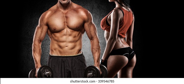 Fitness Couple - Woman And Man With Dumbbells In Gym