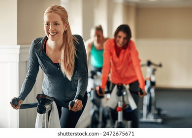 Fitness, cycling and happy girl at gym with exercise bike for training, wellness and morning cardio together. Spinning class, machine and people at sports studio for workout, challenge or performance - Powered by Shutterstock