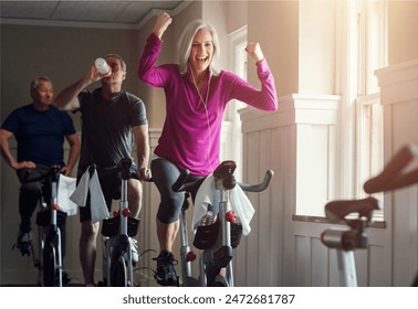 Fitness, cycling and happy woman in gym for celebration, achievement and goal victory. Spinning class, senior people and female athlete as winner, training and exercise success with workout machine - Powered by Shutterstock